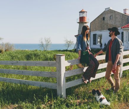 happy-young-stylish-hipster-couple-love-walking-with-dog-countryside-min